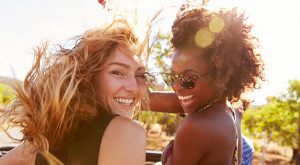 women smiling and laughing outside of cosmetic dentist in San Mateo near burlingame