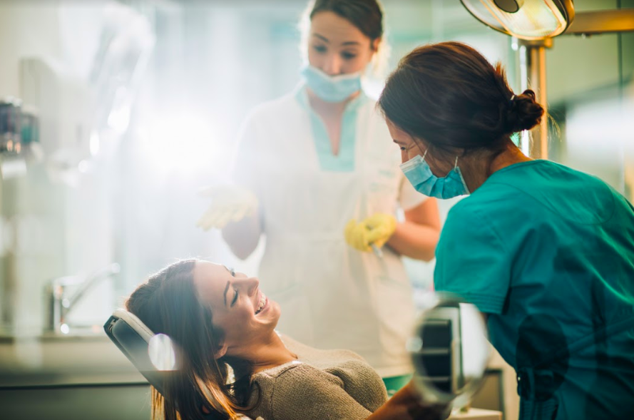female dental paient receiving dental care from cosmetic dentist